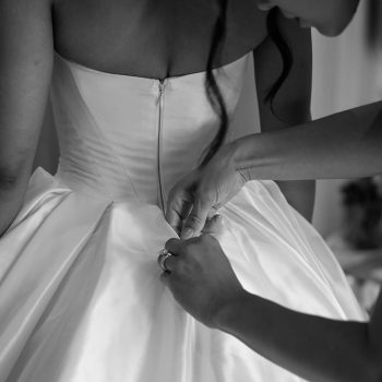 Hair and makeup artist adding final touches to the bride on her wedding morning, Melbourne wedding coordinated by ARLAI Event Co