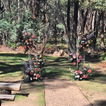 Beautifully decorated wedding aisle with florals and elegant styling.