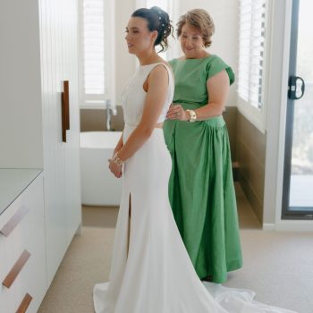 Bride's mom helping her get ready before the big moment