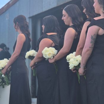 Bridesmaids standing at altar during wedding ceremony