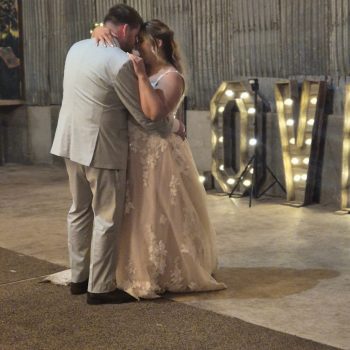 Bride and groom sharing their first dance at the wedding reception