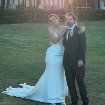 Bride and groom posing for a portrait at their winery wedding.