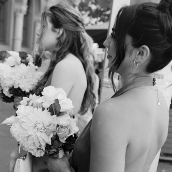 Bridesmaid caught in a candid moment of laughter during the wedding celebration