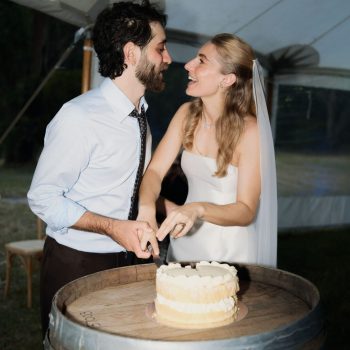 Bride and groom cutting wedding cake at Runnymede Farm Lorne reception, coordinated by ARLAI Event Co Melbourne