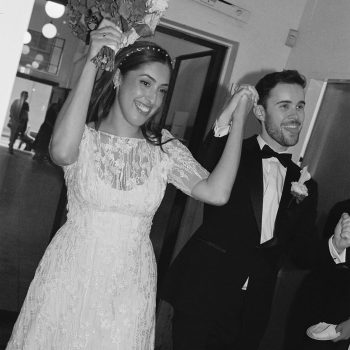 Cheerful wedding couple laughing together in a joyful and natural wedding photo