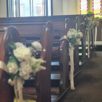 Wedding seating plan displayed for guests at a church ceremony