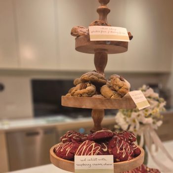 Wedding dessert table with assorted cookies and sweet treats