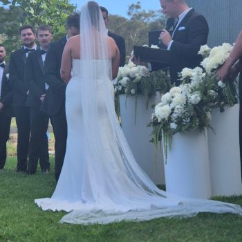 Bride and groom exchanging vows during outdoor wedding ceremony