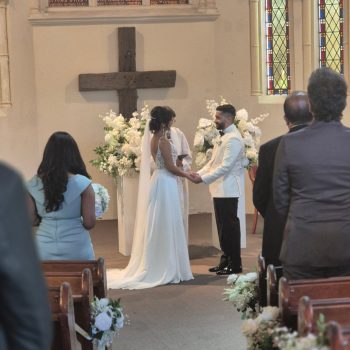 Couple exchanging wedding vows at the altar during their ceremony