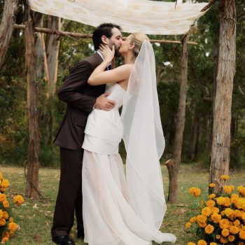 Bride and groom first kiss at Runnymede Farm Lorne farm wedding, coordinated by ARLAI Event Co Melbourne