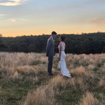 Couple posing for a romantic photoshoot against a peaceful scene