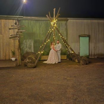 Bride and groom posing for a portrait at the wedding reception