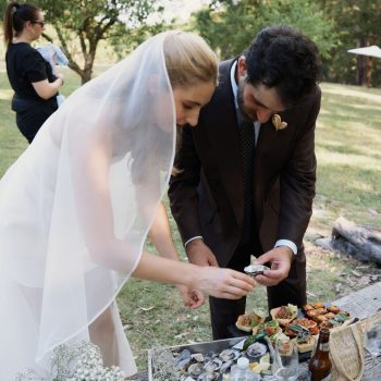 Bride and groom tasting oysters at Runnymede Farm Lorne wedding reception, luxury event coordination by ARLAI Event Co