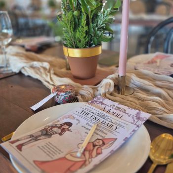 Neatly arranged wedding cutlery placed on an elegant reception table.