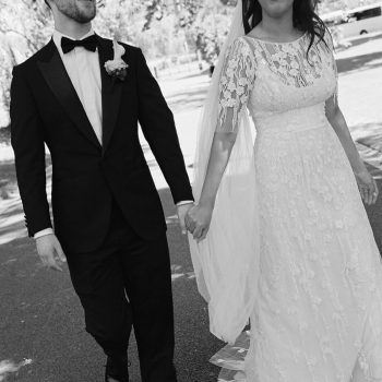 Elegant wedding couple posing together in formal attire at a luxury wedding