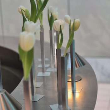 Elegant white tulip floral decor arrangement for a wedding, soft and sophisticated in styling