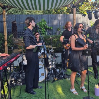 Live musicians performing at a wedding event with instruments