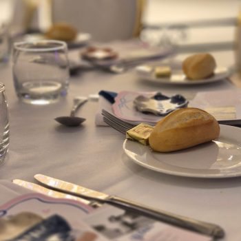 Elegant formal event table setting with décor and glassware.