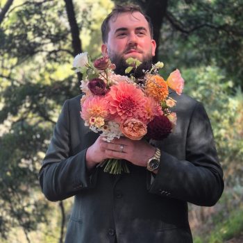 Groom captured in a confident solo portrait on the wedding day.