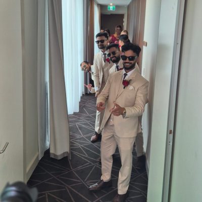 Happy groomsman enjoying wedding reception, smiling and celebrating