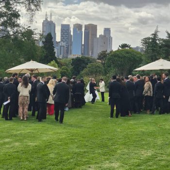 Wedding guests watching the couple exchange vows, a moving and emotional ceremony moment