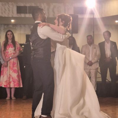 Capturing the joyful bride and groom dance during their wedding reception