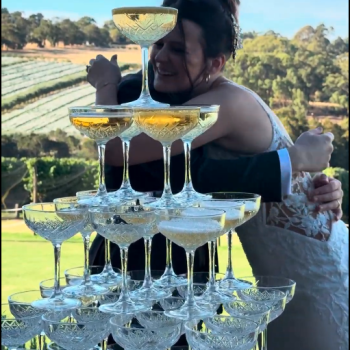 Luxury 5 tier champagne tower setup at a wedding.