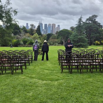 Outdoor wedding ceremony with stunning urban views as a backdrop, modern and scenic venue setting