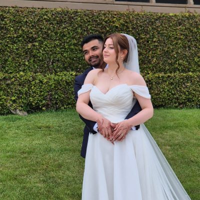 A beautiful wedding couple portrait capturing the love and joy of the bride and groom on their special day.
