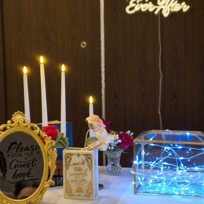 Wedding guest book table setup with elegant decorations and sign-in area