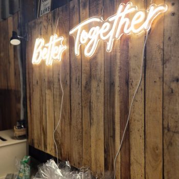 Better Together neon sign at a wedding, part of elegant wedding décor