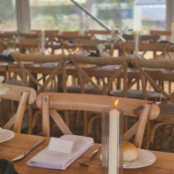 Wedding tables decorated with whimsical candles and floral centerpieces