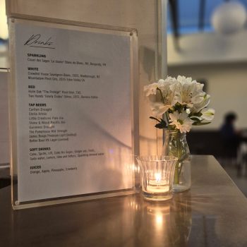 Wedding table menu card displayed with elegant décor